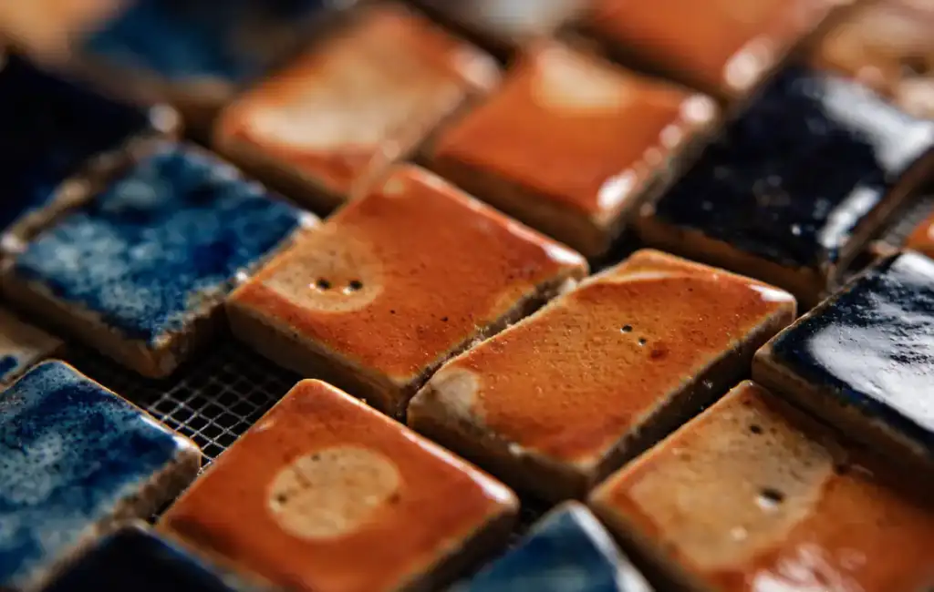 Close-up of ceramic mosaic tile glaze texture and color variation