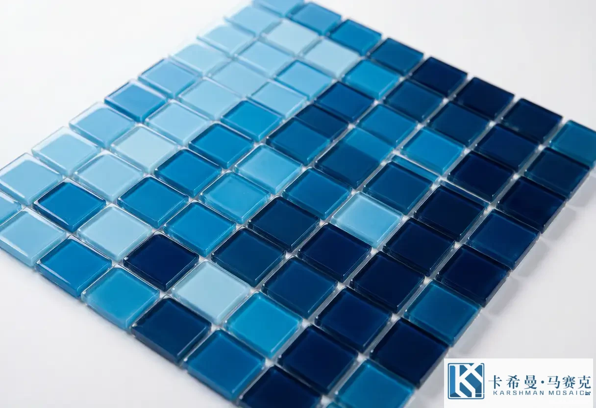 Close up of a gradient glass mosaic tile sheet blending three blue tones
