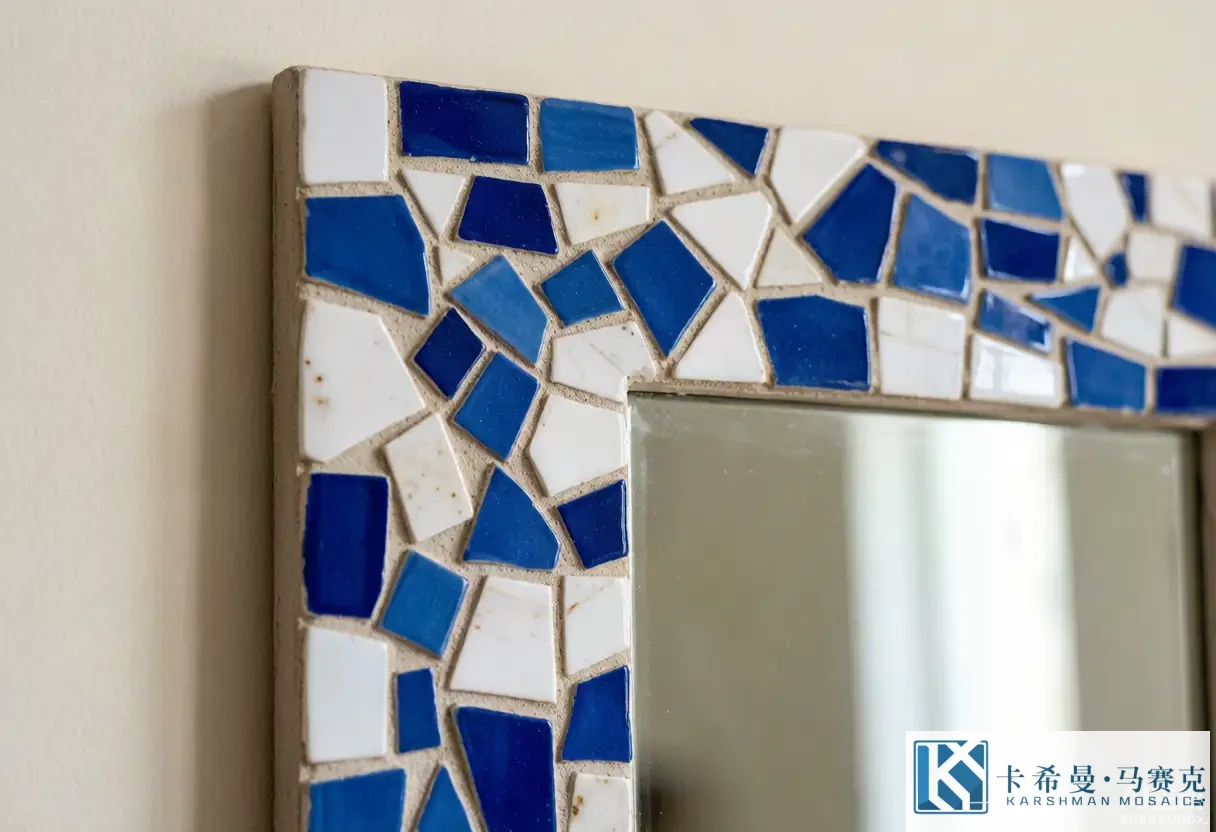 Detailed close-up of a mirror frame covered in hand-laid mosaic tile