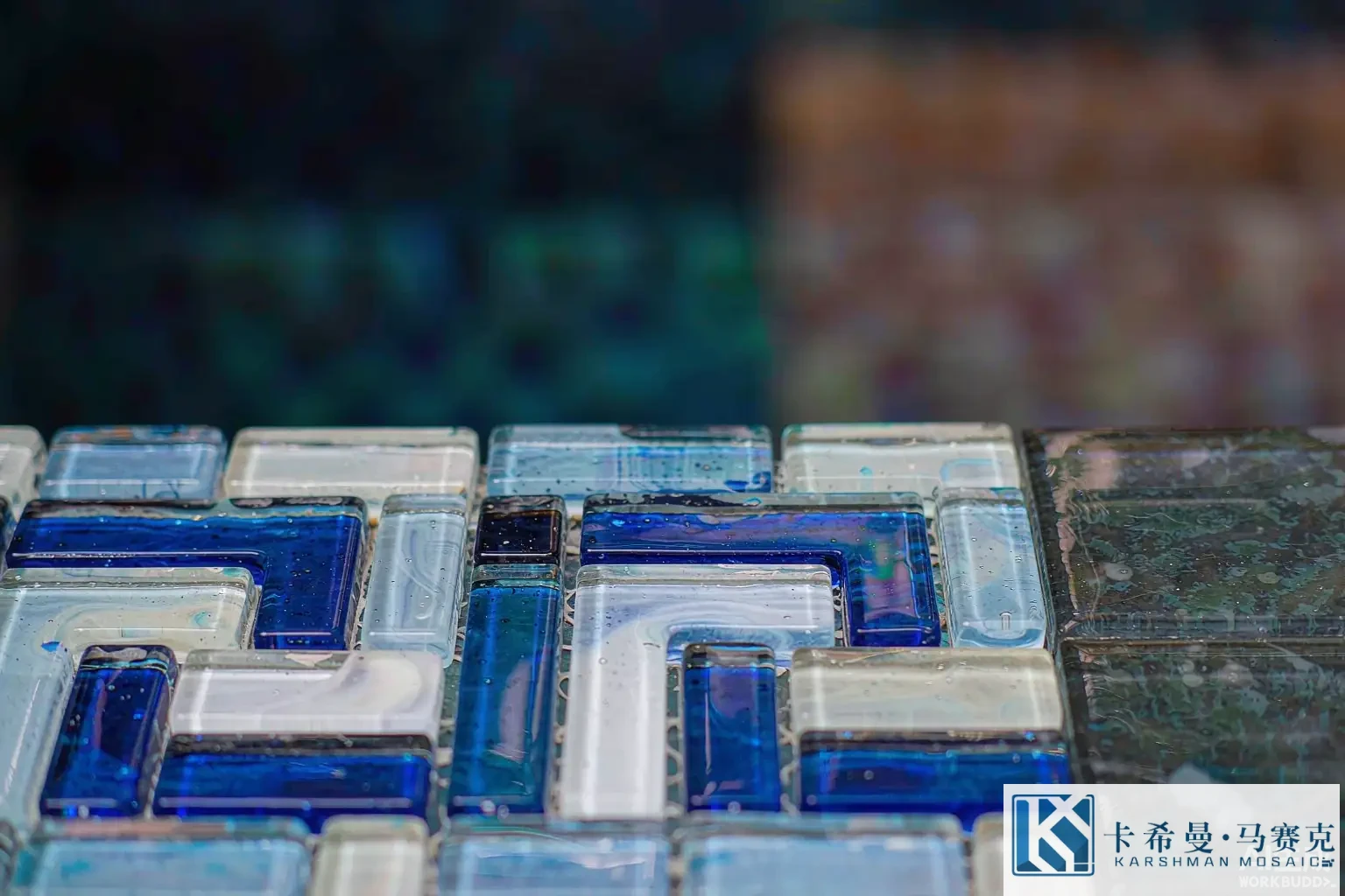 Macro close up of handmade glass mosaic tiles forming a Roman meander Greek key pattern on a pool wall