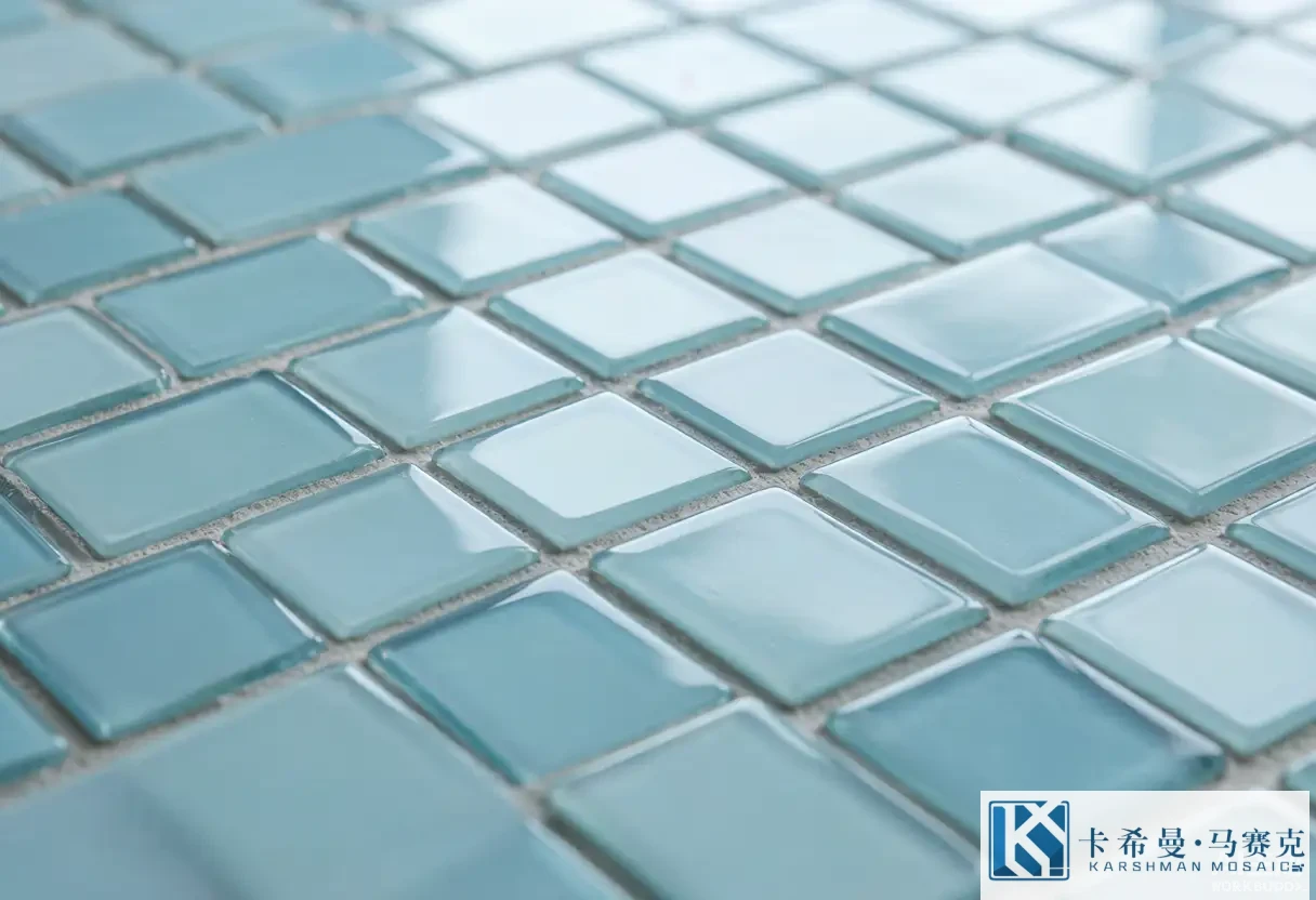 Macro of clean glass mosaic tiles showing intact grout lines and a smooth glossy surface