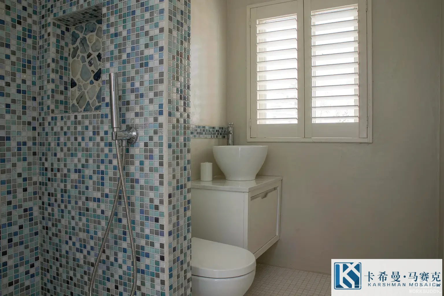 Contemporary bathroom with a glass mosaic feature wall inside the shower and a matching vanity splash, soft light
