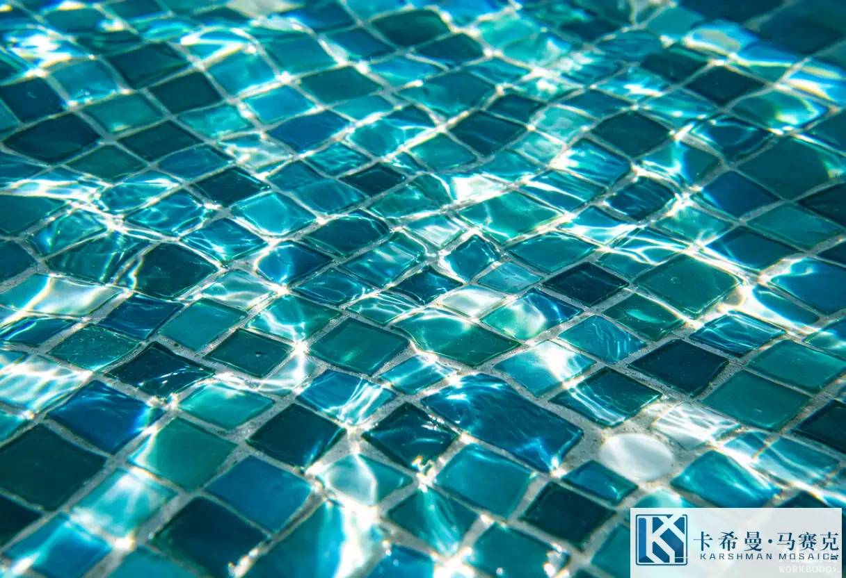 Underwater close view of a pool floor in glossy aqua glass mosaic tesserae with sunlight ripples